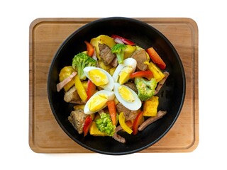 Colorful Savory Stir-fry with Vegetables and Boiled Egg in Skillet on Wooden Board