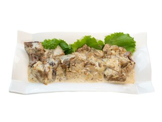 Creamy Beef Stroganoff with Fresh Lettuce on Elegant White Platter
