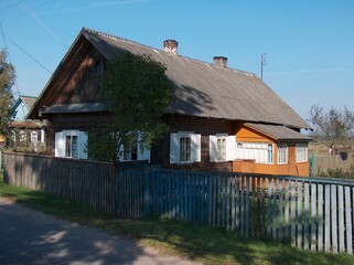 Fototapeta premium belarus, village, field, gardens, houses, roads, sidewalks, trees, flowers, river, forest, pine trees, spruce, meadows, pasture, huts, fence, well