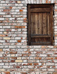 Old wooden window on a brick wall. Old vintage wooden window