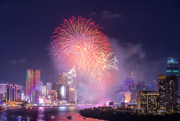 Celebration. Skyline with fireworks light up sky over business district in Ho Chi Minh City ( Saigon ), Vietnam. Beautiful night view cityscape.