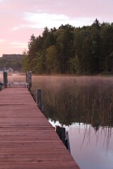 Obraz premium dock in the lake at sunrise
