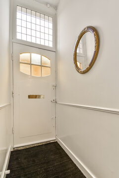 Classic white entrance hall with decorative mirror