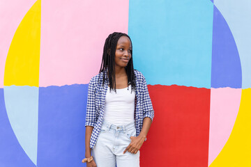 Black woman against a vibrant urban background