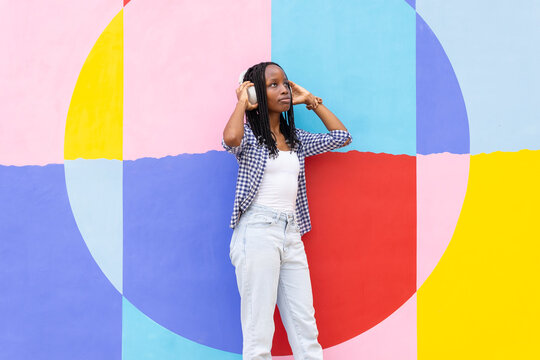 Black woman in colorful urban setting
