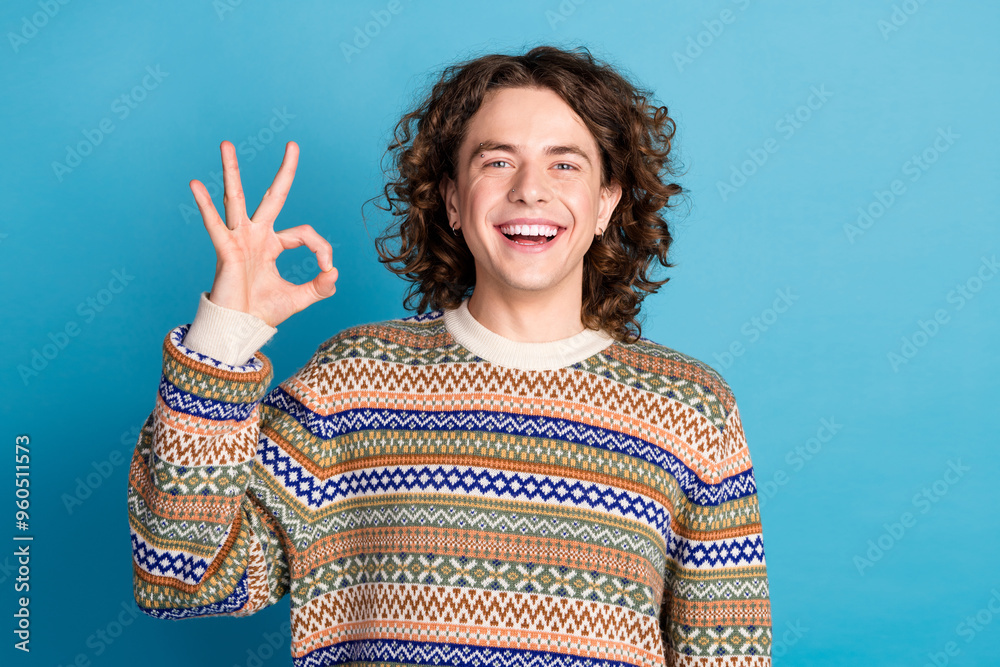 Sticker photo of optimistic guy with wavy hairdo dressed ornament sweater showing okey approve good work iso