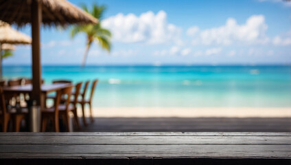 The empty black wooden table top with blur background of restaurant on the beach. For product display