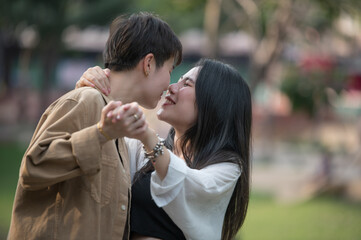 Happy Asian lesbian lgbtq couple dating in love