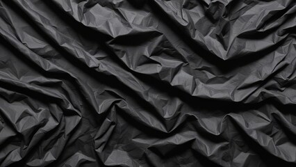 crumpled black plastic texture as background.