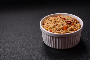 Delicious hot boiled wheat porridge couscous with vegetables