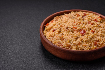 Delicious hot boiled wheat porridge couscous with vegetables