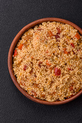 Delicious hot boiled wheat porridge couscous with vegetables
