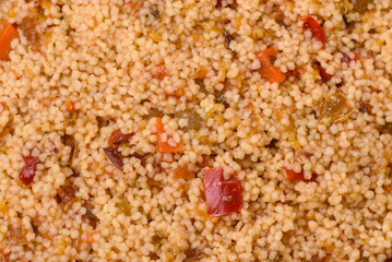 Delicious hot boiled wheat porridge couscous with vegetables