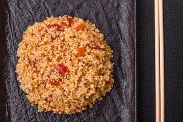 Delicious hot boiled wheat porridge couscous with vegetables