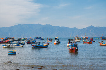 Vietnamese traditional boats at sea at port in a fishing village in Nha Trang in Vietnam at summer...