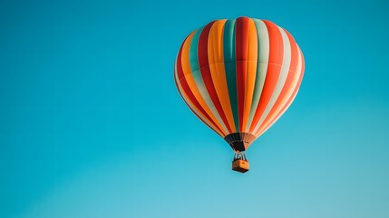 Fototapeta premium Hot Air Balloon Soaring in the Blue Sky