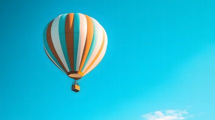 Naklejka premium Hot Air Balloon Soaring Through a Clear Blue Sky