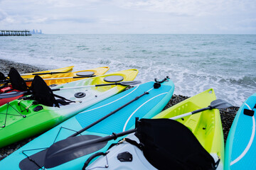 Kayaks and SUP boards on the sea. Extreme sport. Leisure. High quality photo