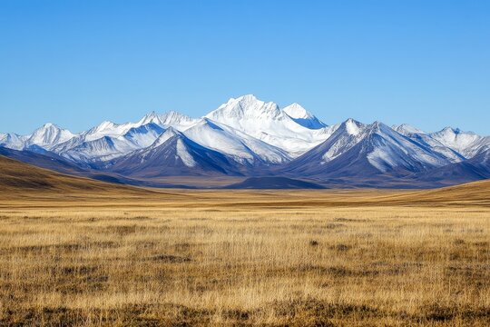 A distant view of snow-capped mountains under a clear blue sky 