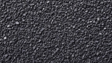 Fototapeta premium black pebbles with texture as background.