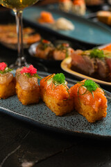 Sushi on Black Stone Table