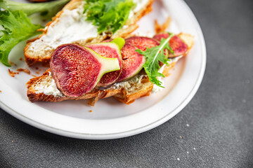 Fig sandwich croissant, cream cheese fresh meal food snack on the table copy space food background rustic top view
