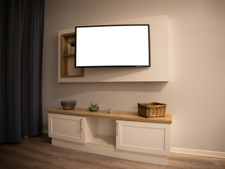 Blank TV screen in a living room interior. Template for any multimedia content in a domestic environment in the evening. Neutral place at home with modern impersonal furniture.
