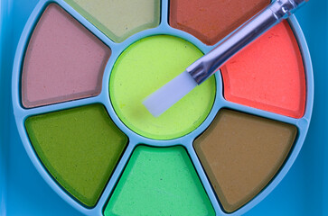 Macro of Chidren Watercolor Palette and Paint Brush