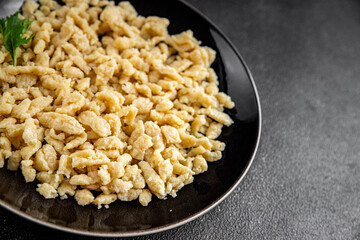 pasta spaetzle egg pasta irregular shape fresh meal food snack on the table copy space food background rustic top view