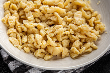 pasta spaetzle egg pasta irregular shape fresh meal food snack on the table copy space food background rustic top view