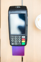 View from above of a payment terminal on a table