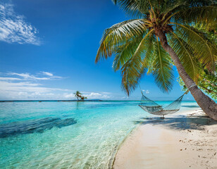 A tropical beach with crystal-clear waters, palm trees swaying, and a hammock gently rocking