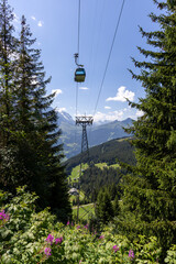 Cable car ascending up the mountain, Swiss Alpine landscape © B7 Photography