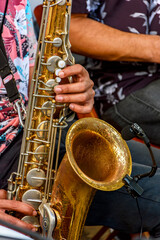 Saxophonist and group of musicians during a musical performance on the streets of Recife