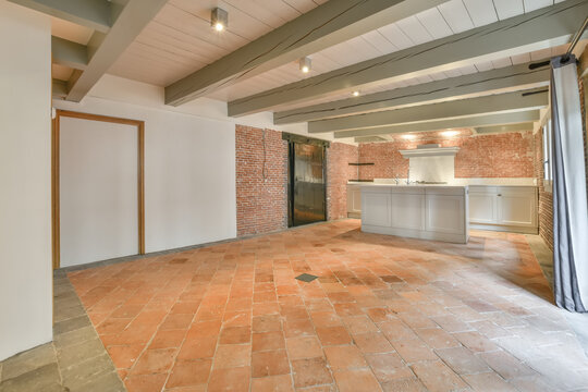 Spacious Rustic Kitchen Interior with Brick Walls