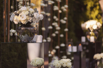 Birthday candles on transparent cubes dove floristry. Wedding decor of a Banquet hall in a...