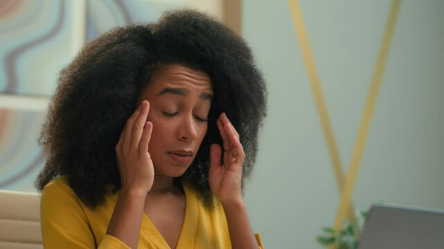 African American woman female businesswoman unwell tired frustrated ethnic business girl office worker typing laptop feel bad health suffer migraine pain overworked hurt ache headache tension stress