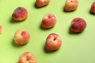 Sweet fig peaches on green background