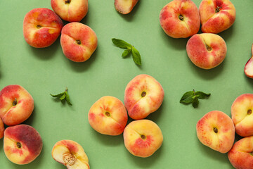 Sweet fig peaches and mint on green background