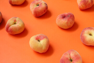 Sweet fig peaches on orange background