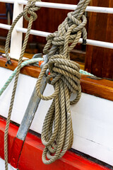Ropework against an old wooden ship hull