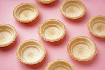 Homemade tartlets on pink background