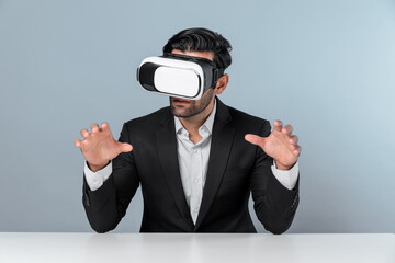Smart businessman sitting while pointing and choosing data analysis by using technology innovation. Professional caucasian project manager using virtual reality glasses and VR goggles. Deviation.