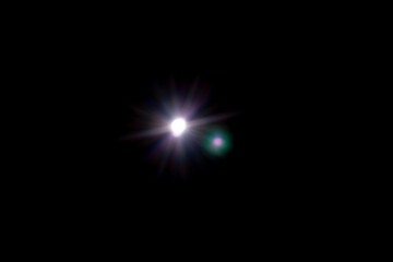 Star shaped lens flare on black background.