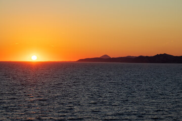 Greek sunsets over the Aegean sea during summer 
