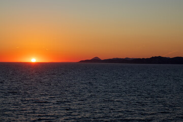 Greek sunsets over the Aegean sea during summer 