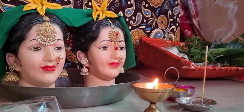 Two idol goddess gauri with pooja decoration in ganpati festival