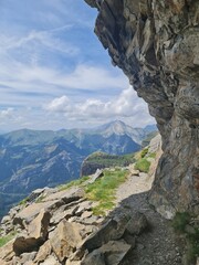 Small hinking path with steep walls and mountain view