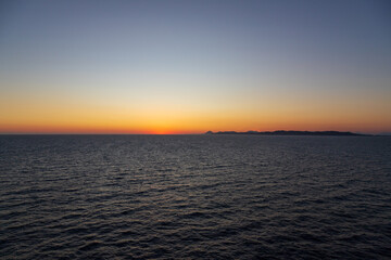 Greek sunsets over the Aegean sea during summer 