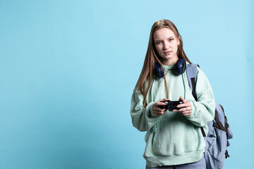 Young gamer girl holding controller, focused on finishing difficult videogame level. Woman gaming...